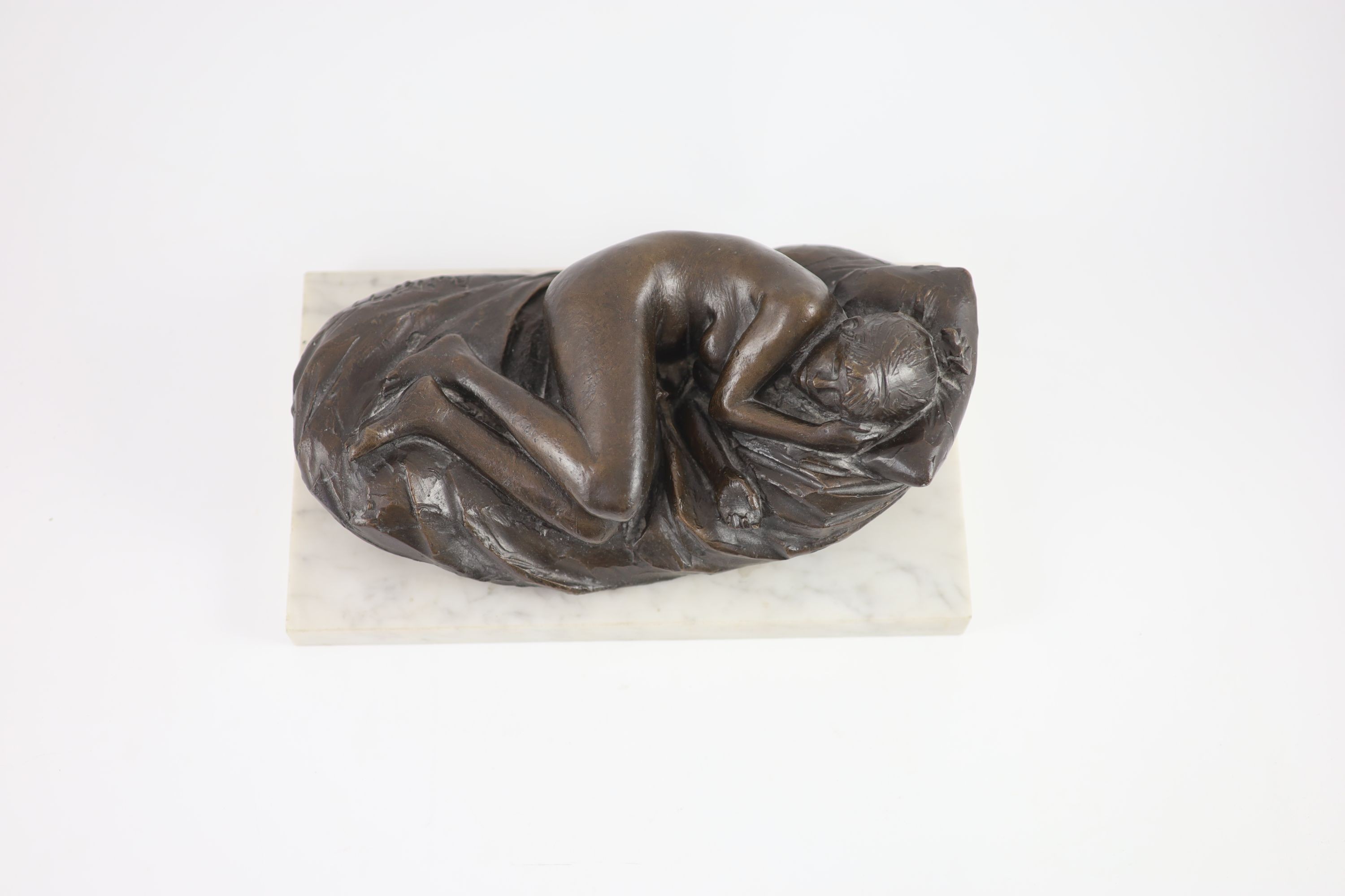 James W. Butler. RA., A bronze model of a sleeping girl, width 31cm depth 18cm height 13cm